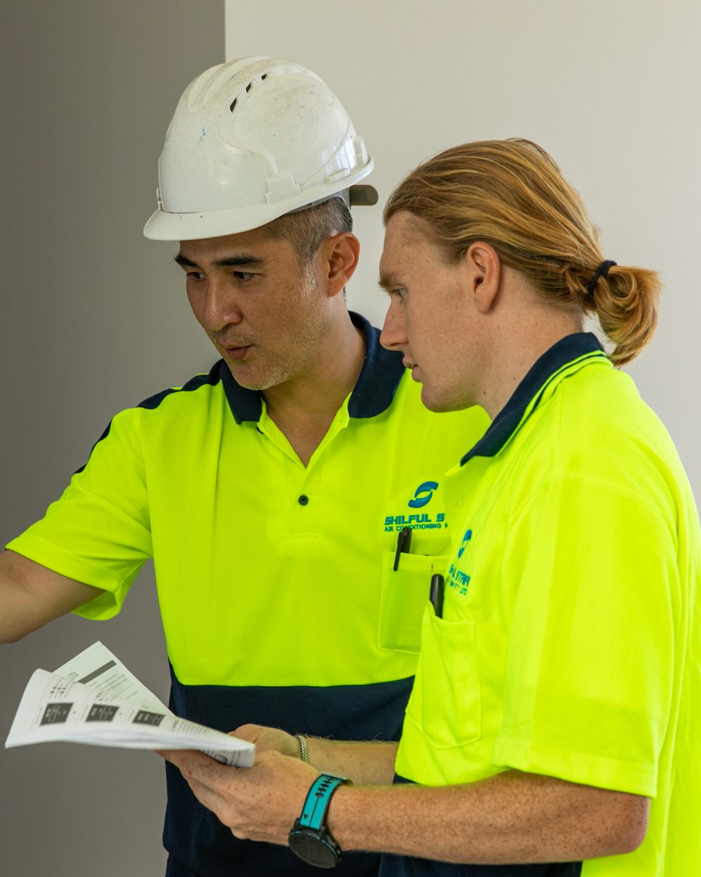 Maintenance records and documentation Skilful Star technicians checking equipment documentation on site