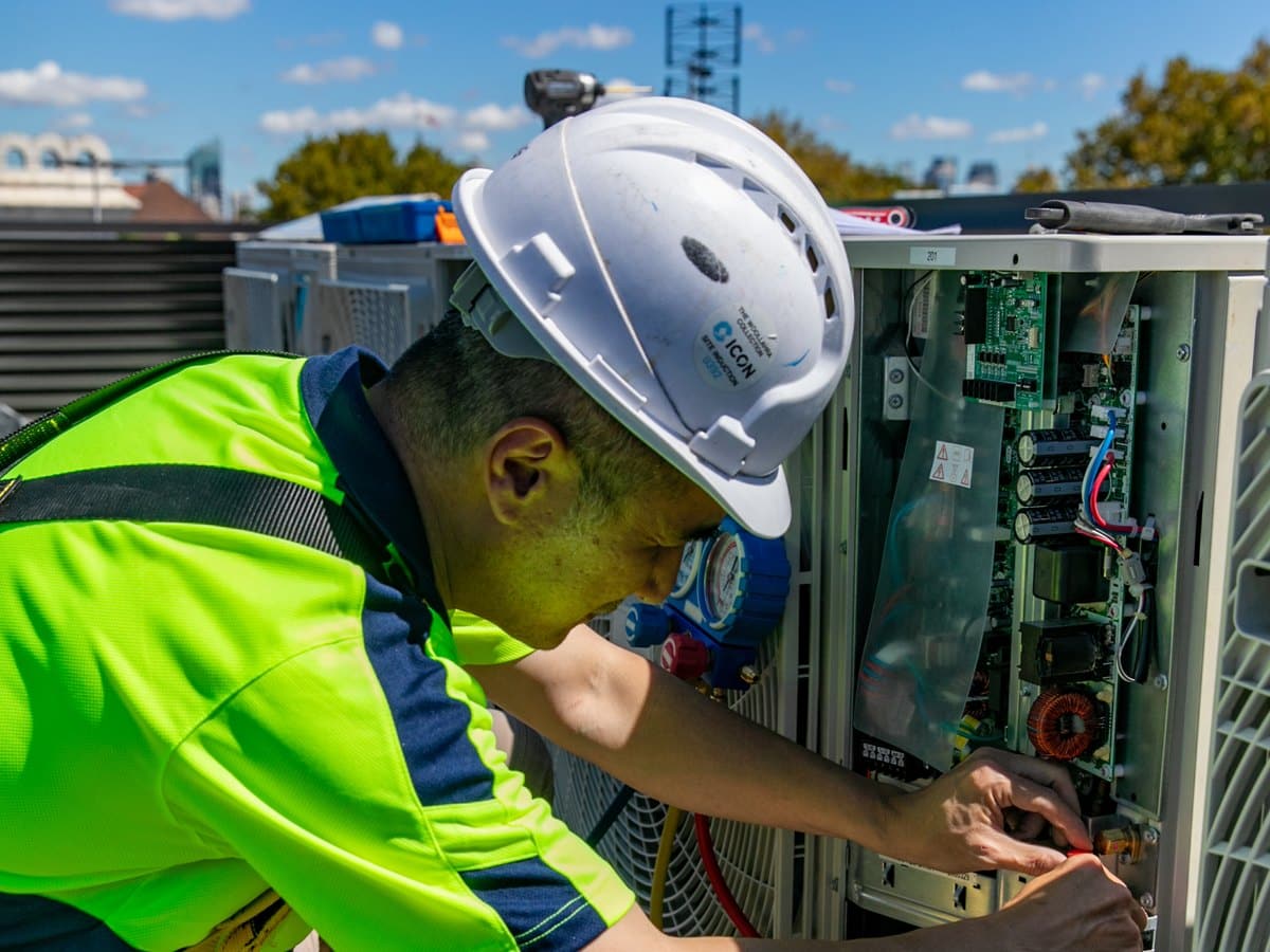 Skilful Star technician servicing a condensing unit control panel
